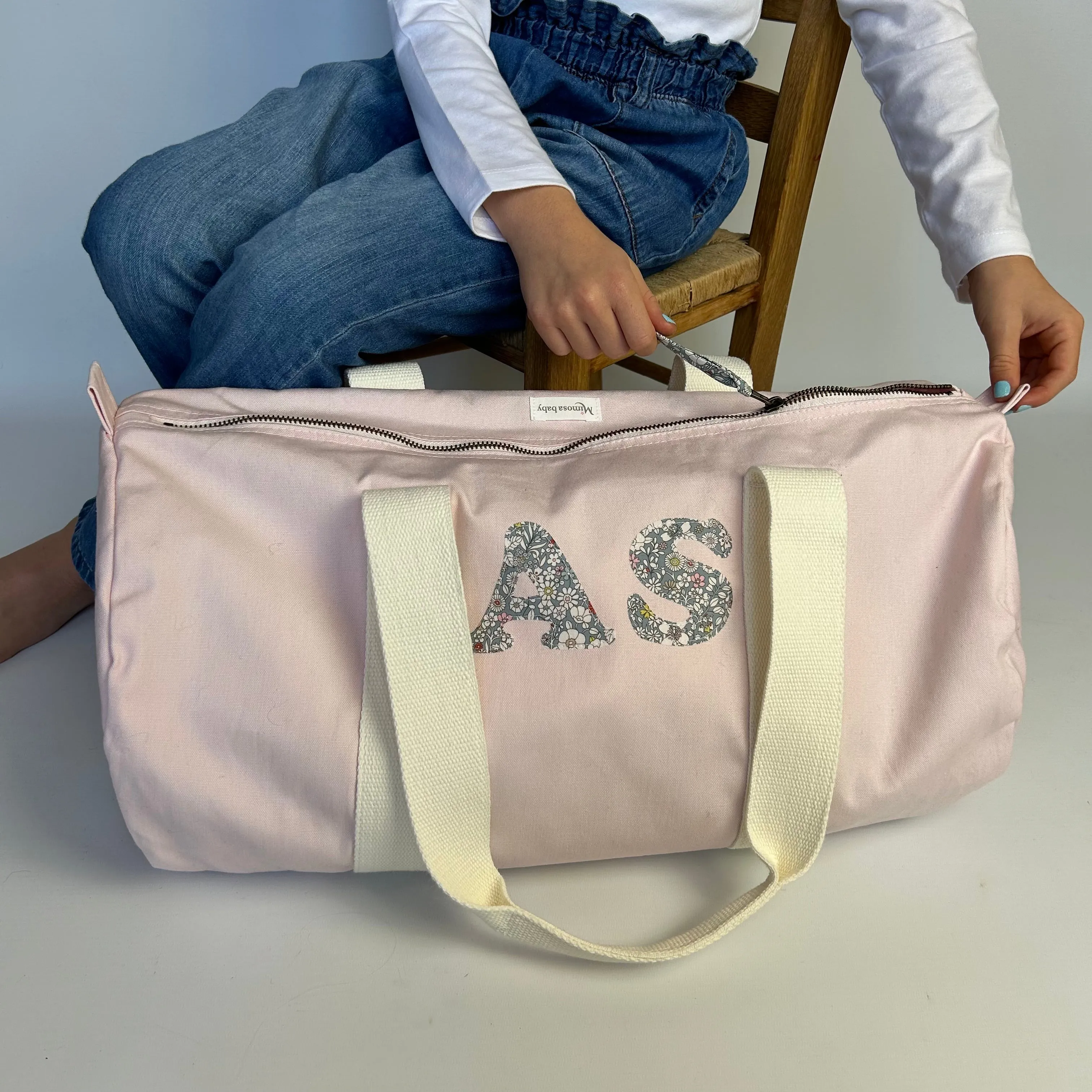 Double initial barrel bag.