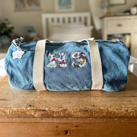 Double initial barrel bag.