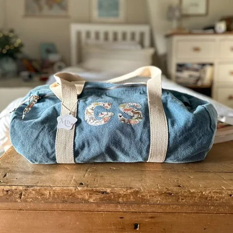 Double initial barrel bag.